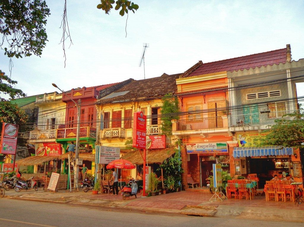 Delgithfully dilapidated french colonial buildings along the riverside in Kampot