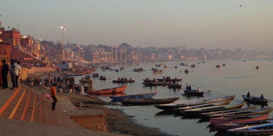 The Ghats and the holy river Ganges at sunrise in Varanasi 