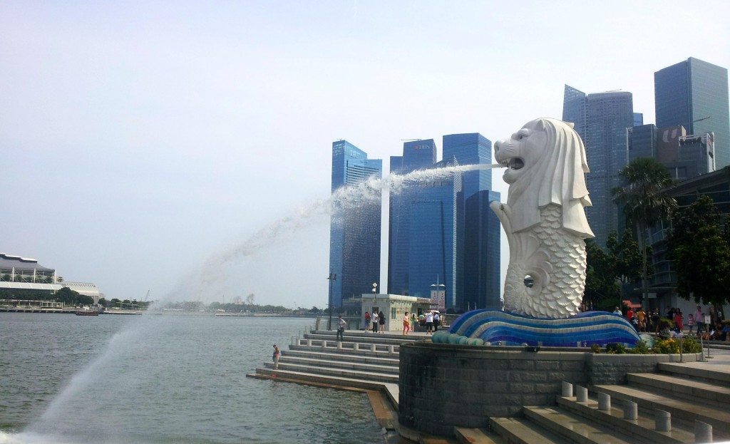 Merlion - half fish, half lion stands proudly in front of the skyscrapers of the CBD