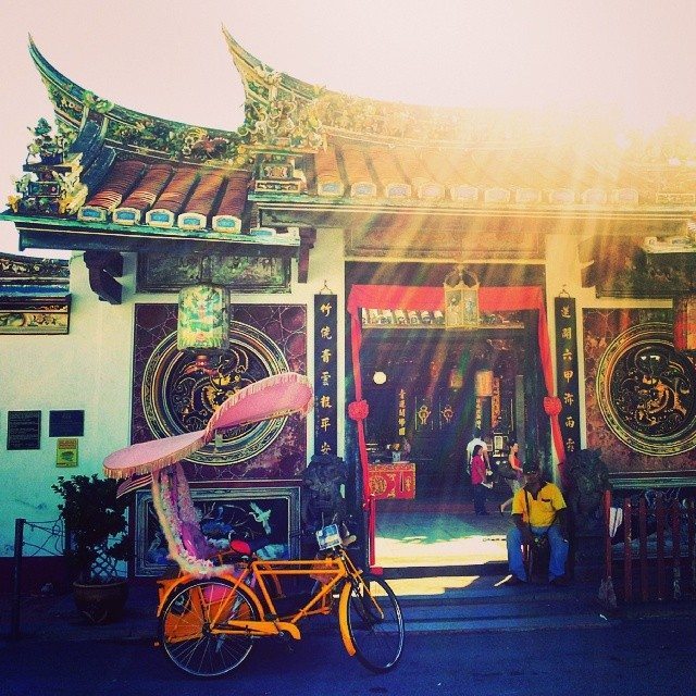 trishaw and chinese temple in Malacca / melaka in Malaysia 