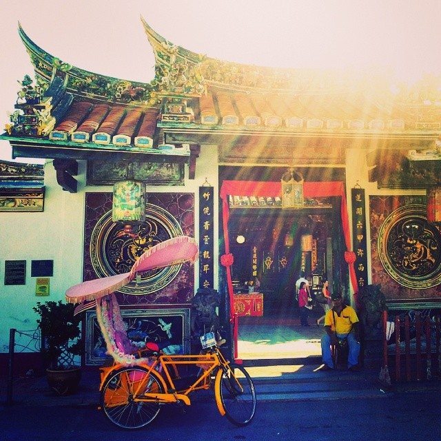 trishaw and chinese temple in Malacca / melaka in Malaysia