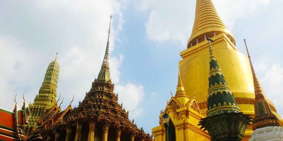 The golden spires and chedis of the elaborate Grand Palace and Wat Phra Kaew
