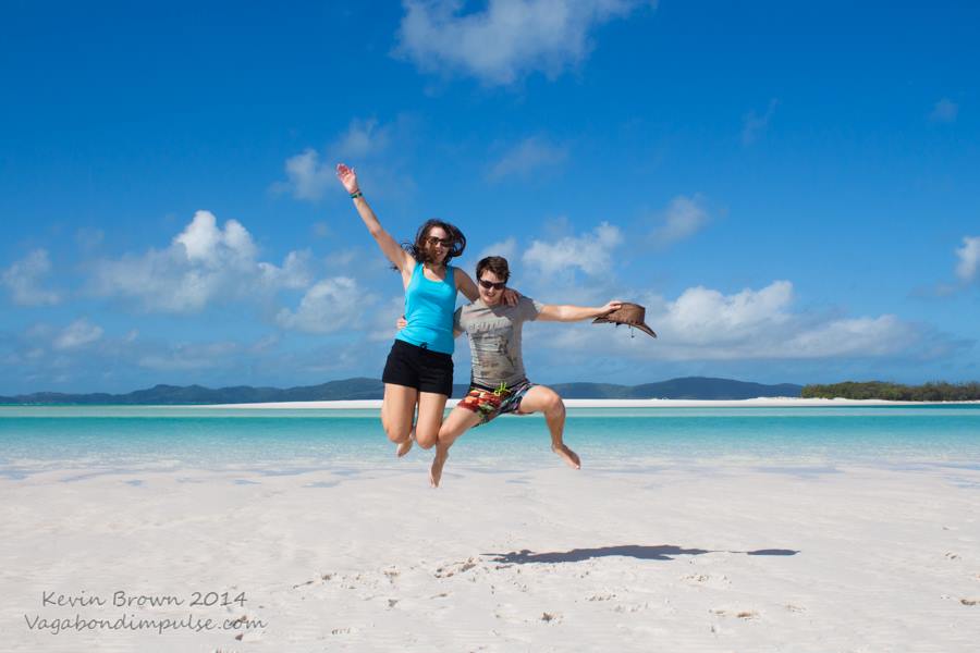 jumping for joy on whitehaven beach