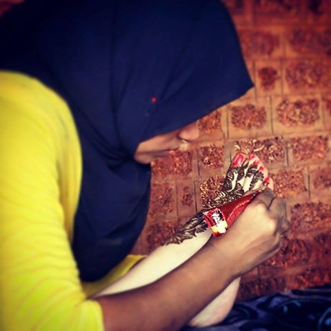Getting mehendi done on my feet at the Raviz Hotel