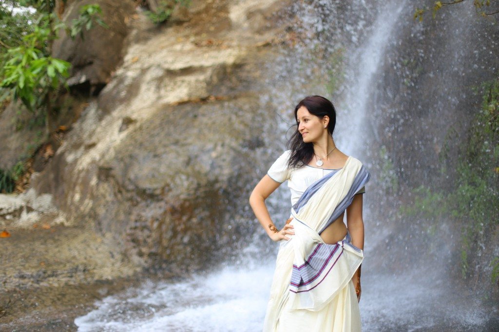 Alex wearing a sari in a waterfal in Wayanad, Kerala