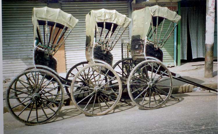 Handpulled rickshaws in Calcutta. Photo Credit: http://www.indiamike.com/