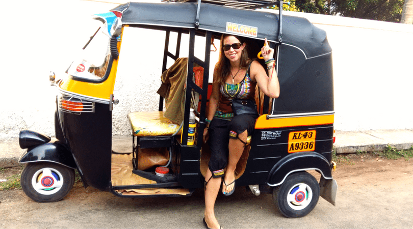 riding a rickshaw or tuk tuk while backpacking in india