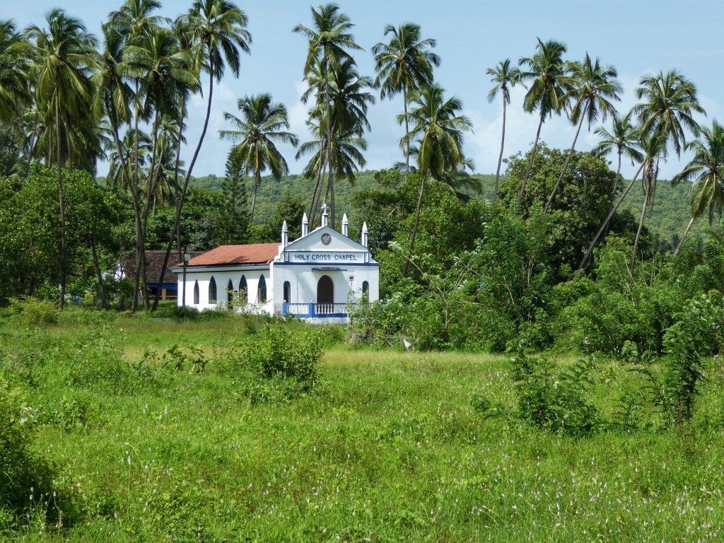 Cute Portuguese churches and green fields in Goa in monsoon season