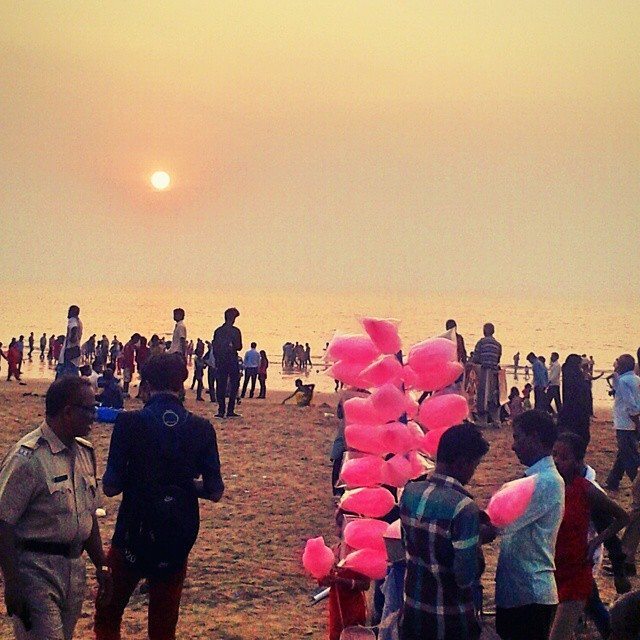 Crowds at sunset enjoying Mumbai's Juhu beach