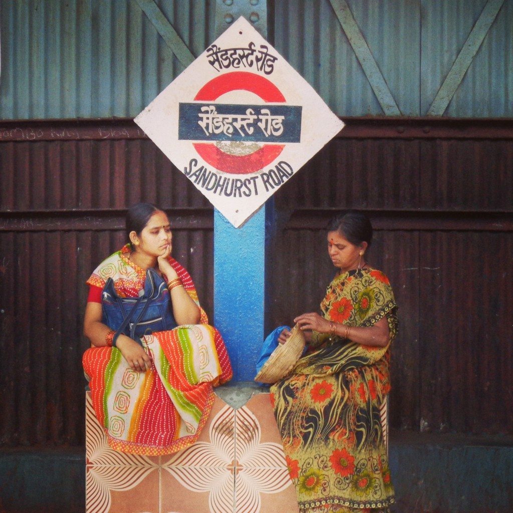 Ladies waiting at a train station in Mumbai