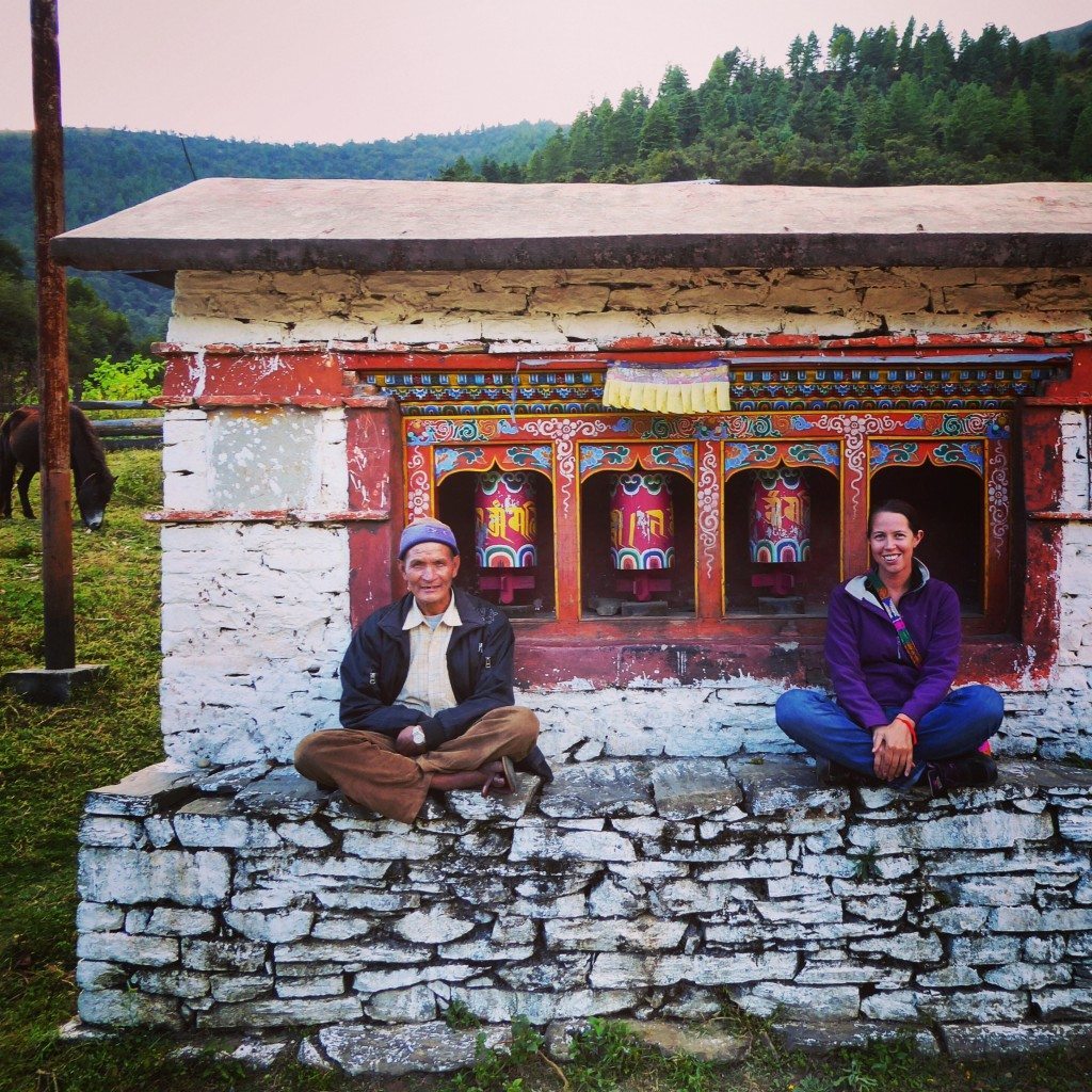 sitting by the tibetan prayer wheels in arunachal pradesh