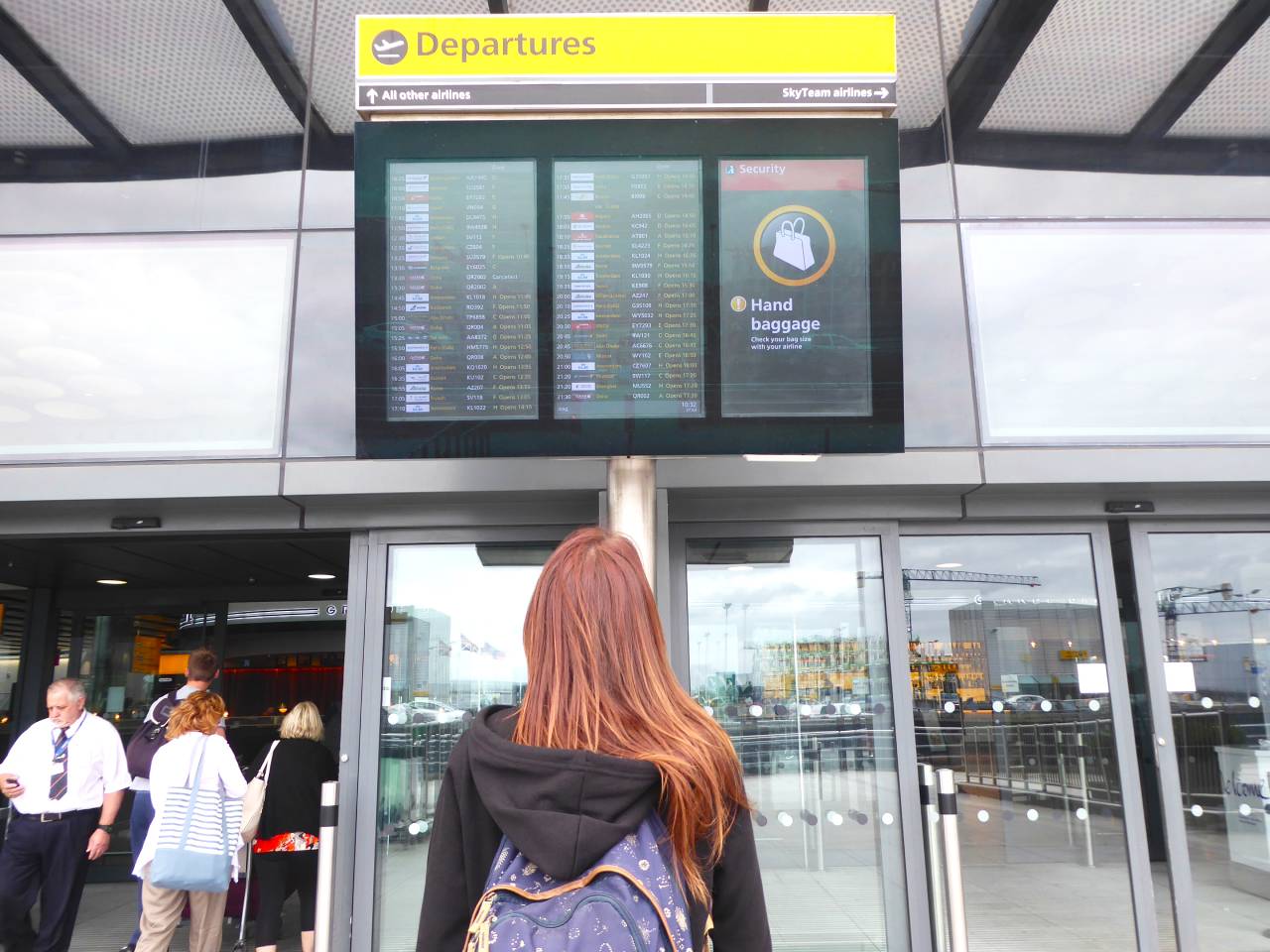 me at departure board heathrow airport