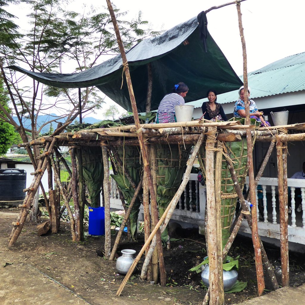 Making Apong - rice wine at the Mopin festival in Aalo, Arunachal Pradesh