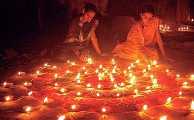 Lighting candles for Diwali