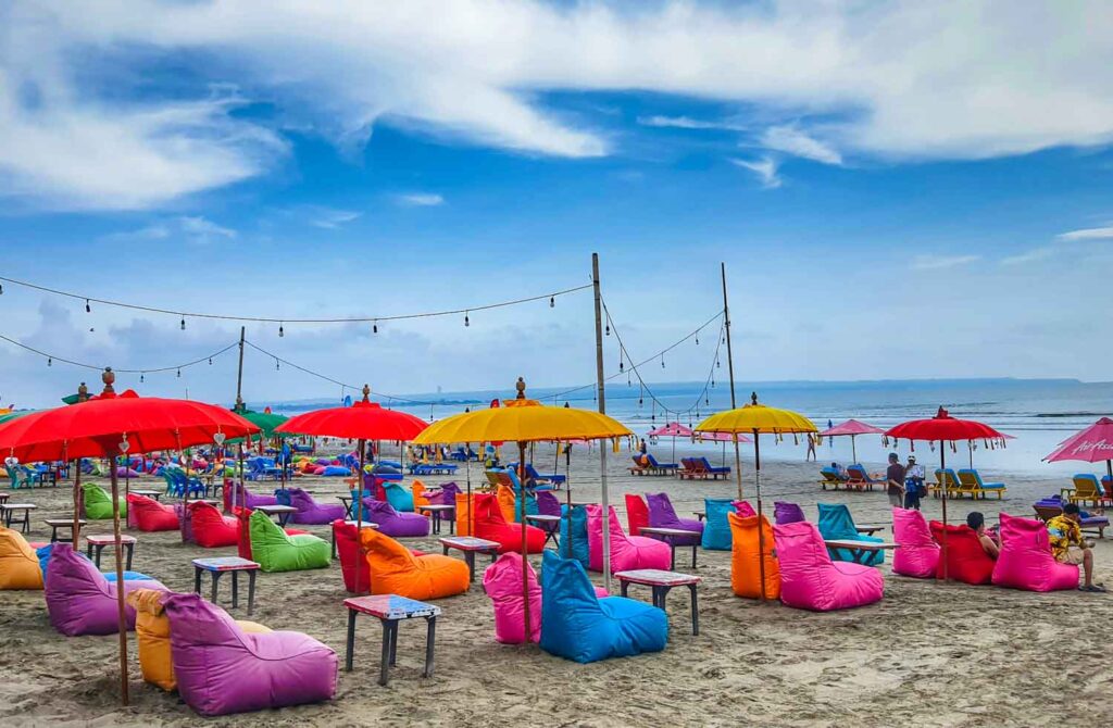 colourful beanbag beach club on seminyak beach, bali