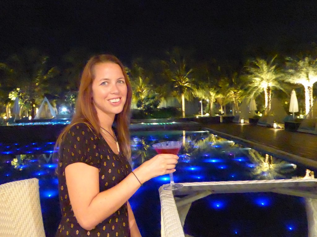enjoying a cocktail by the pool at planet hollywood a luxury hotel in goa
