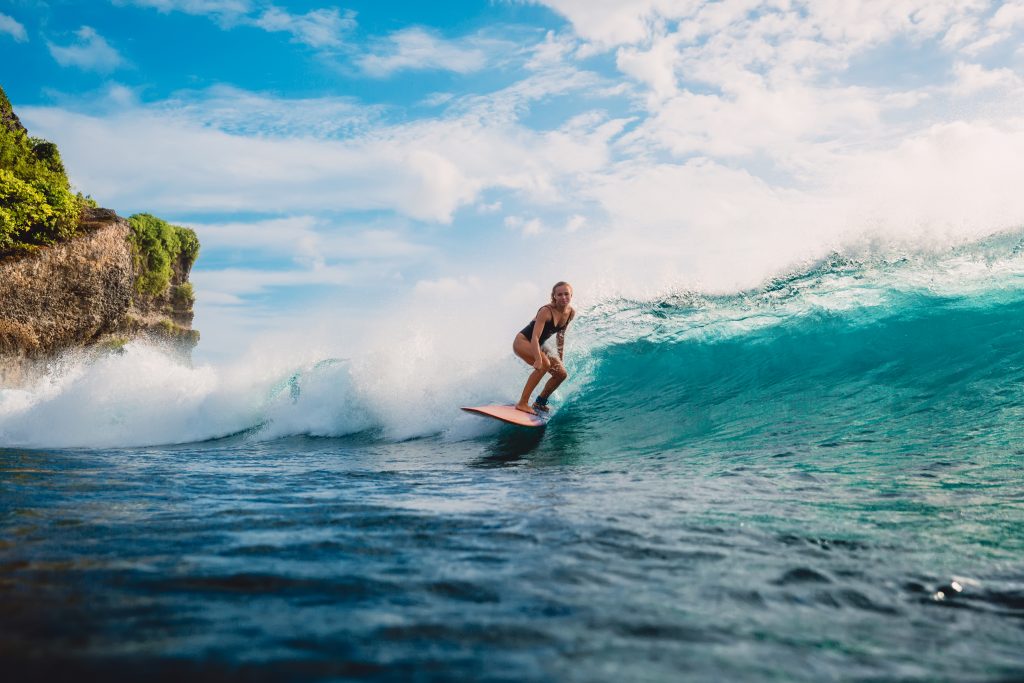 Girl Surfing in Bali. Photo credit: Wonderful Nature (Shutterstock)