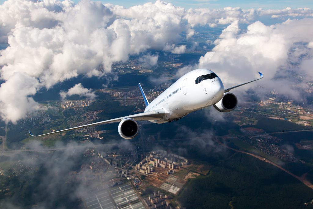 Aircraft is flying high above the city