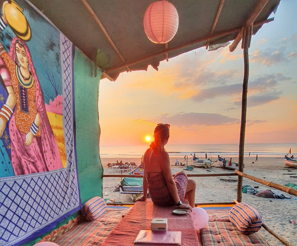 Anna watching sunset on the beach in Goa