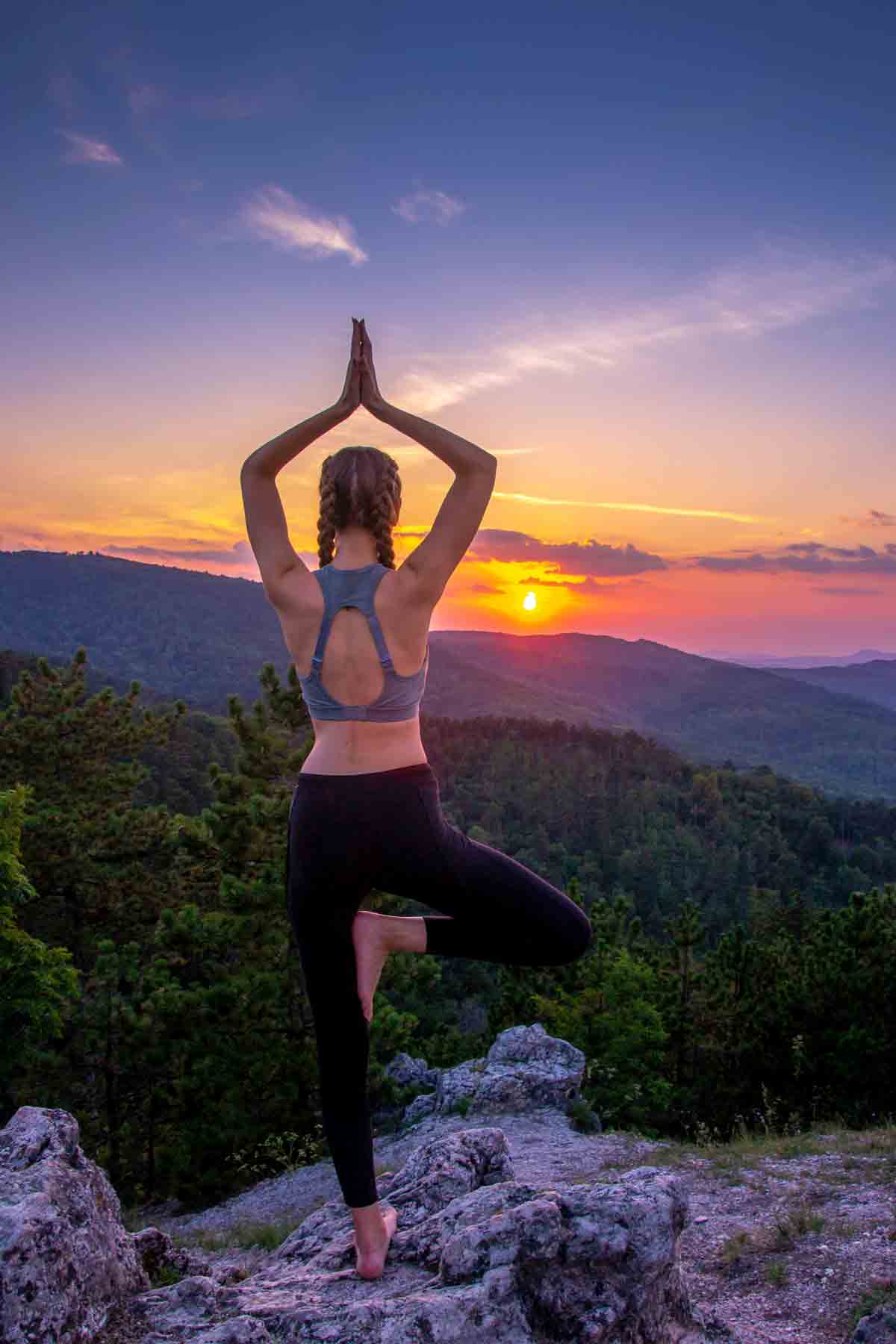 Yoga on a mountain at sunset