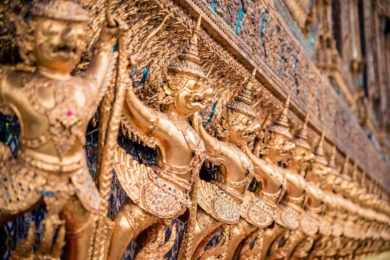 golden garudas at the temple of the emerald buddha in the grand palace in bangkok