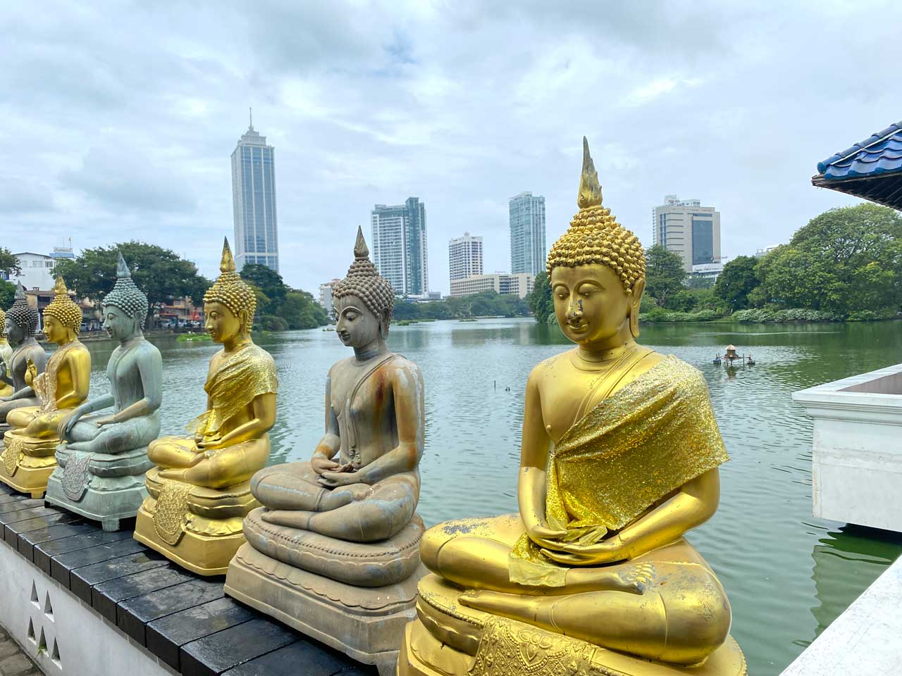 golden buddhas temple on the lake in in colombo sri lanka 