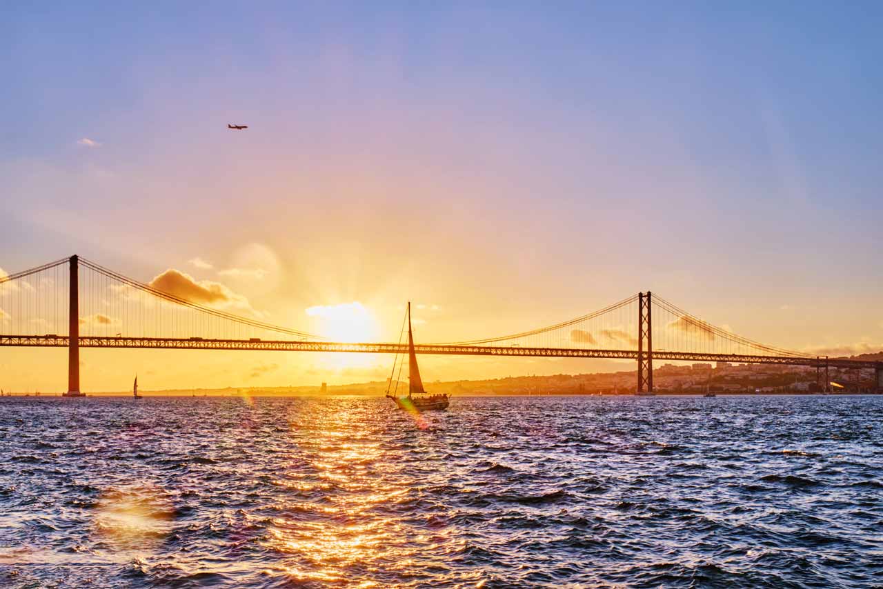 tagus river and bridge at sunset lisbon