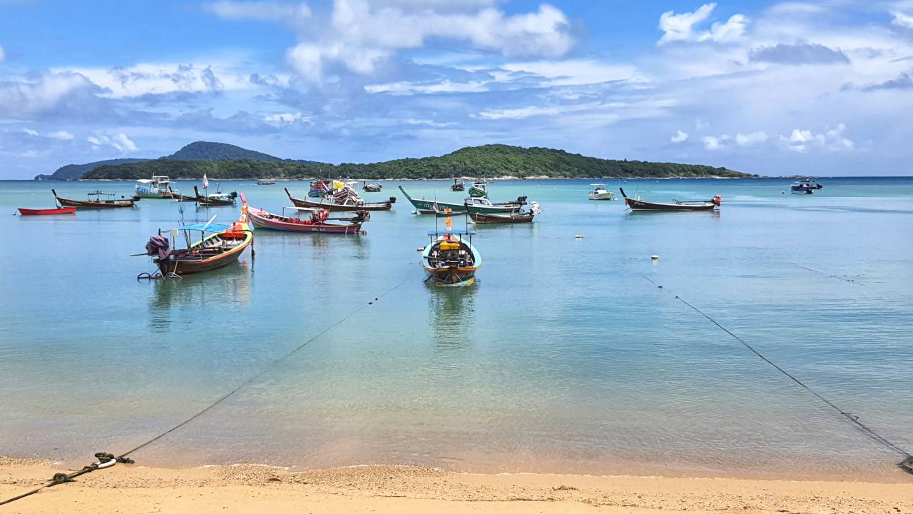 rawai beach with boats in phuket thailand